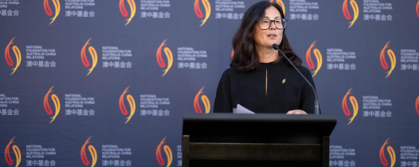 Ms Marina Go AM delivers speech at a lectern