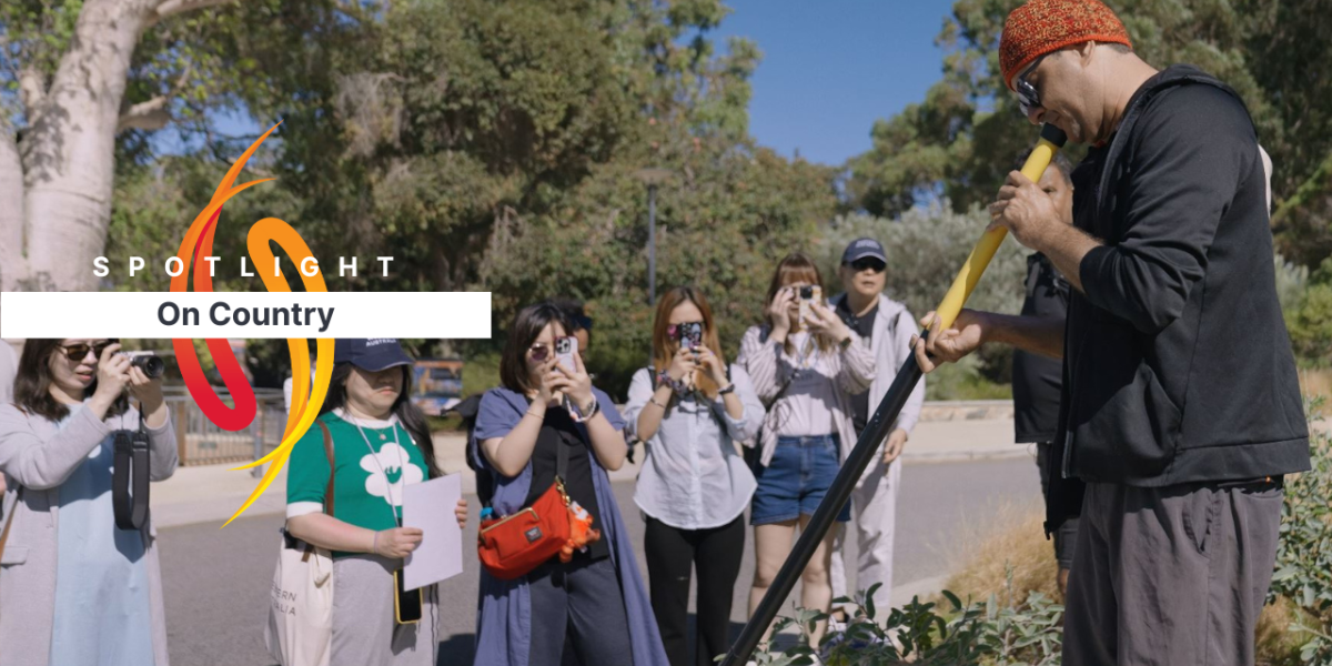 A group of Chinese visitors in a park