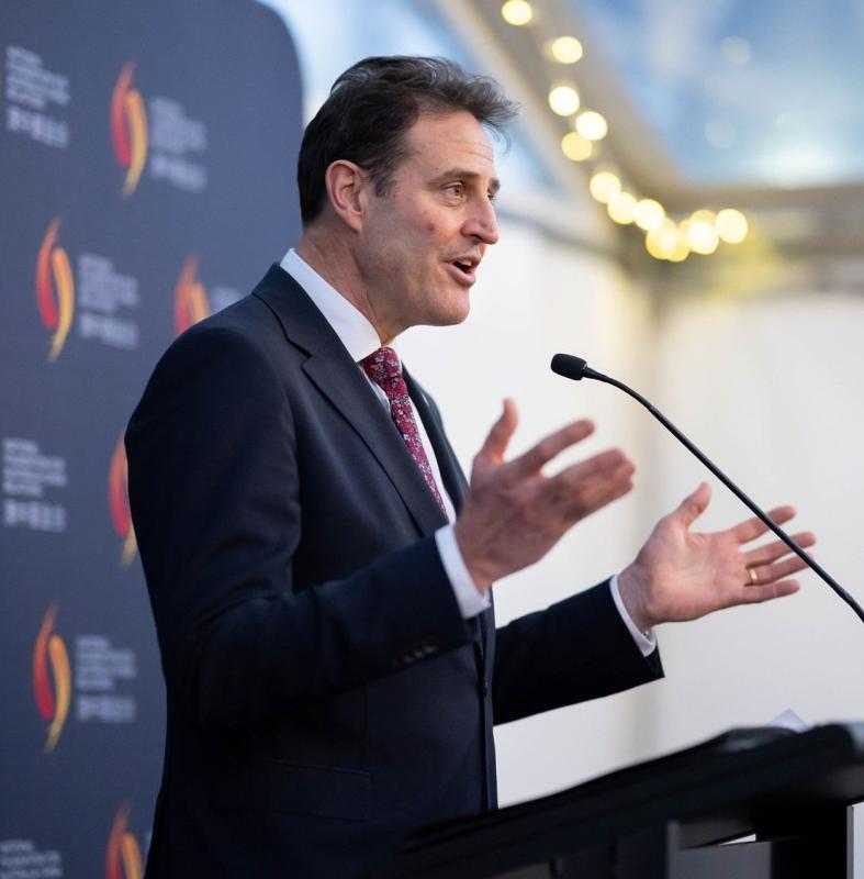 CEO Cowan at lectern